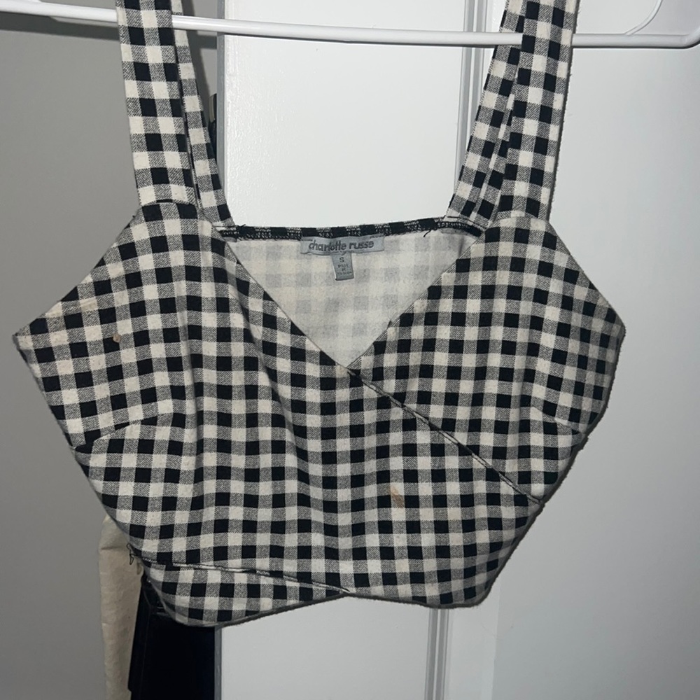 This Charlotte Russe black and white checkered crop top is a size small.